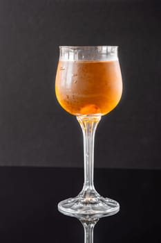 Glass of Waterloo cocktail on the black background