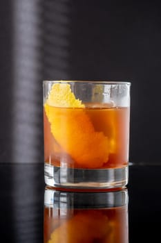Hunter's tea cocktail garnished with lemon zest