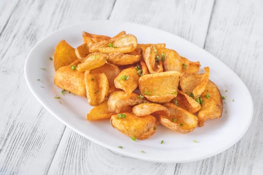 Portion of dip fried potato dippers on the plate