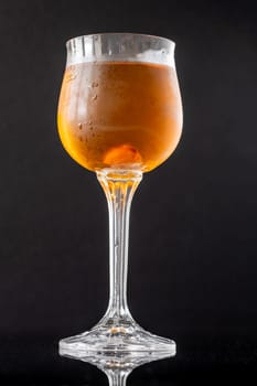 Glass of Waterloo cocktail on the black background