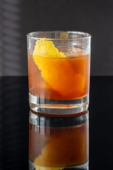 Hunter's tea cocktail garnished with lemon zest