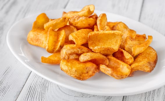 Portion of dip fried potato dippers on the plate