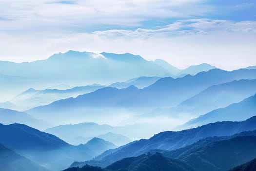A view capturing a range of towering mountains in the distance, dominating the horizon with their rugged peaks and valleys stretching across the landscape.