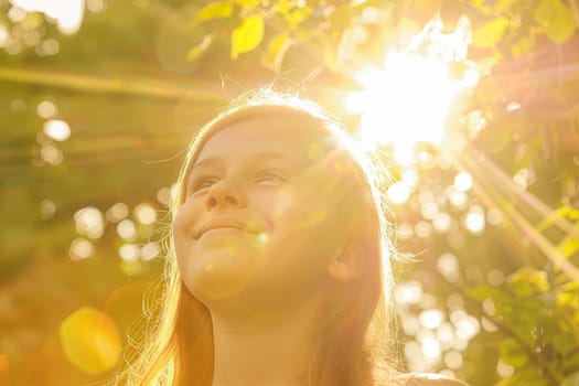 A young girl stands with her head tilted back, gazing up at the bright sun shining down on her. Her eyes squint slightly as she takes in the warm rays above.