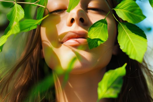 A woman with green leaves covering her face, creating a nature-inspired mask. She appears serene as she blends with the surrounding foliage.