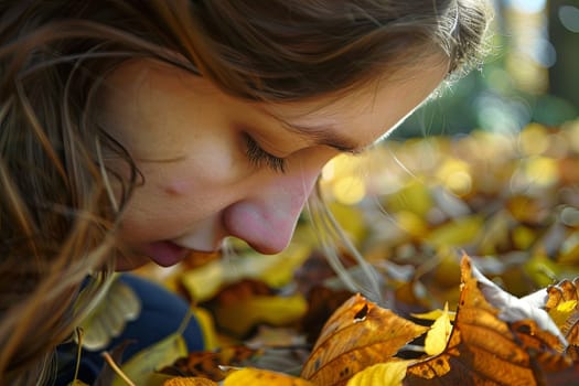 A candid moment captured as a young girl stands in contemplation, looking down at the fallen leaves scattered around her feet.