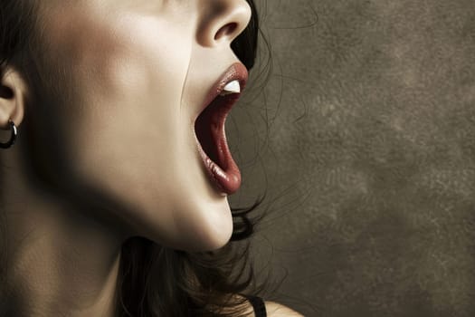 A woman is pictured with her mouth open and tongue sticking out. It appears she is making a playful or silly expression, with her facial muscles tensed and lips apart. This action could be a sign of excitement, teasing, or jesting.