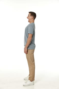 surprised guy looking at camera on white studio background