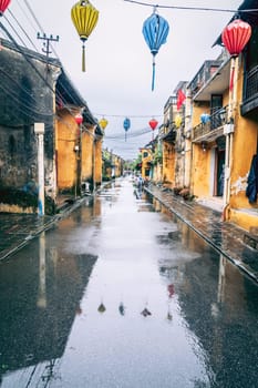 Street scene in the old town of Hoi An, Vietnam on a rainy day