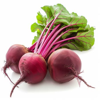 A collection of beets arranged in a group and placed neatly on a white surface - isolated raw food