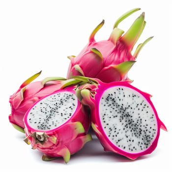 A dragon fruit, sliced into half, resting on a plain white background - isolated raw food
