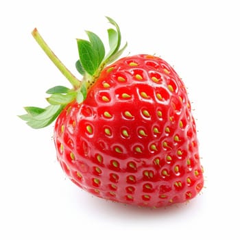 A vibrant red strawberry with fresh green leaves, isolated on a white background