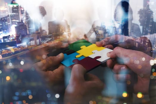 Business people connect puzzle pieces as integration and startup
