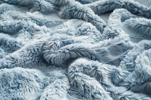A close-up view of a luxurious blanket, showcasing its incredibly soft and plush texture. The fabric appears inviting and cozy, perfect for providing warmth and comfort.