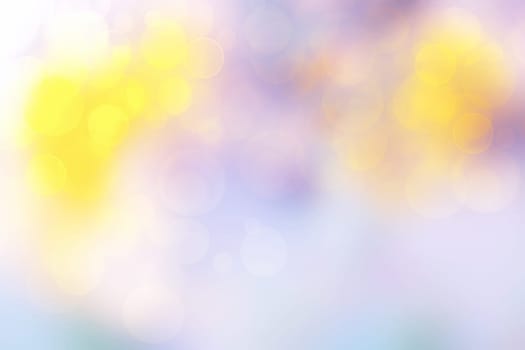 Abstract blurred vivid spring summer light delicate pastel yellow pink blue bokeh background texture with bright soft color circles and bokeh lights. Card concept. Beautiful backdrop illustration..