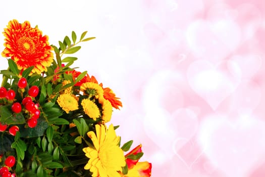 Greeting card template. Decorative bouquet of flowers over abstract blurred hearts background with copy space for text. Spring, valentine, mothers or wedding day.