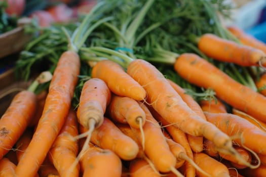 A neat pile of carrots sitting next to each other, showcasing their vibrant orange color and fresh appearance. Each carrot is straight and uniform, creating a visually appealing display.