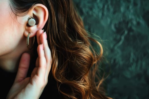 A female individual is featured in the picture, wearing a set of ear piercings. The womans earlobes are adorned with small pieces of jewelry, enhancing her appearance.