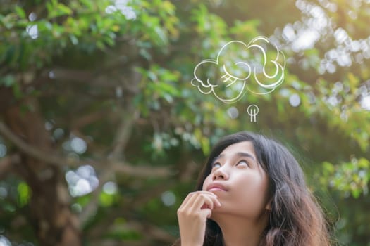 A woman stands, looking upwards at a speech bubble floating above her head. The thought bubble indicates contemplation and insight as she ponders deeply.