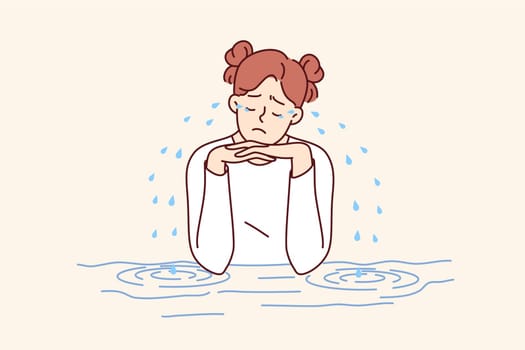 Teenage woman is crying sitting at table, experiencing stress and depression due to problems with classmates or school bullying. Girl crying after breaking up with boyfriend or quarrel with friend