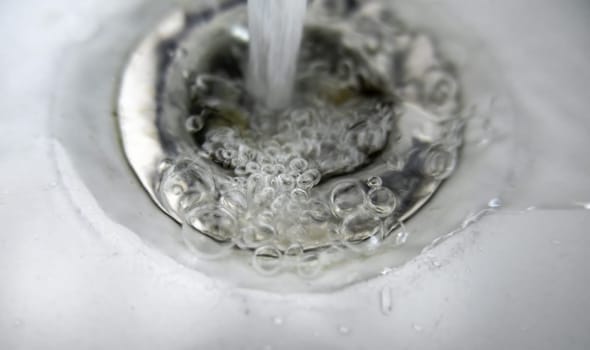 Detail of water in a sink, dirty water drain