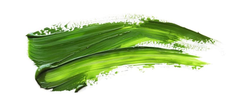 An abstract green streak of paint, with energetic splatters and fluid motion, on a stark white canvas