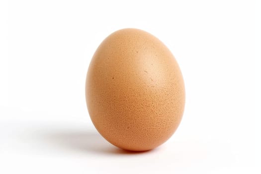 A single brown egg rests on top of a white table surface. The eggshell is smooth and glossy, contrasting with the clean simplicity of the table.
