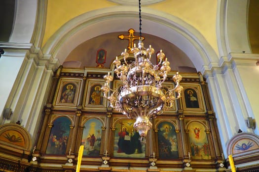 Kotor Montenegro 08.11.22 The Church of St. Nicholas attracts pilgrims tourists. Orthodox center. Interior and decoration of church, altar, icons, candles, chandeliers and antique tiles on the floor