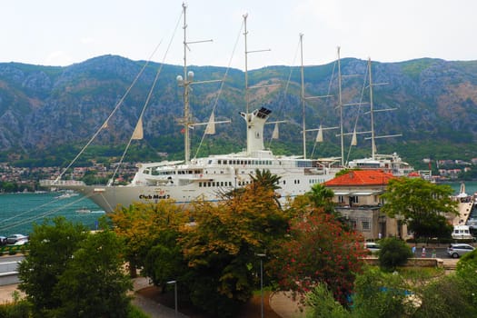 Kotor, Montenegro, 08.11.22 view of Adriatic Sea from historical center of old town. Cruise ship, tourists, cars and mountains in summer evening. Tourism business in the Balkans and the Mediterranean