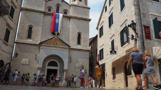 Kotor, Montenegro, August 11, 2022: The Church of St. Nicholas attracts pilgrims and tourists. Orthodox center. The architecture of the building combines elements of the Renaissance and late Gothic.