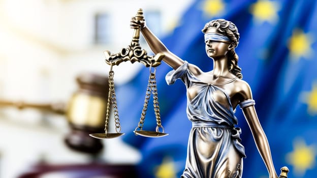Lady Justice statue in focus, with EU flag blurred in the background. Perfect for copy space.