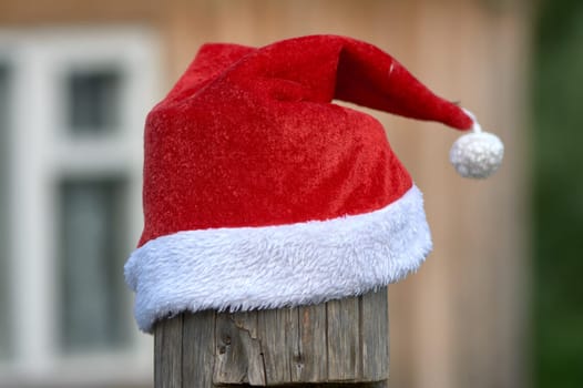santa Claus hat is put on a pole. High quality photo