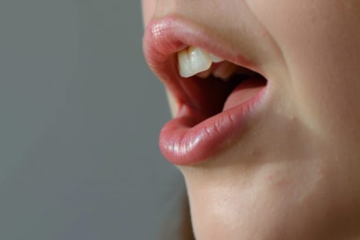 A detailed view of a persons mouth with one tooth visibly missing. The gum area where the tooth once was can be seen clearly.