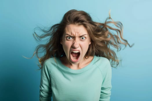 A woman is shown with a startled look on her face, eyebrows raised and mouth slightly open. Her eyes widen in astonishment as she reacts to something unexpected.
