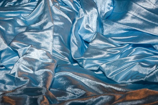 Shiny solid color light blue fabric