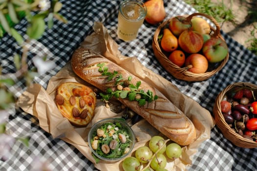 A table displays a variety of fresh bread, colorful fruits, and vibrant vegetables under the sun.