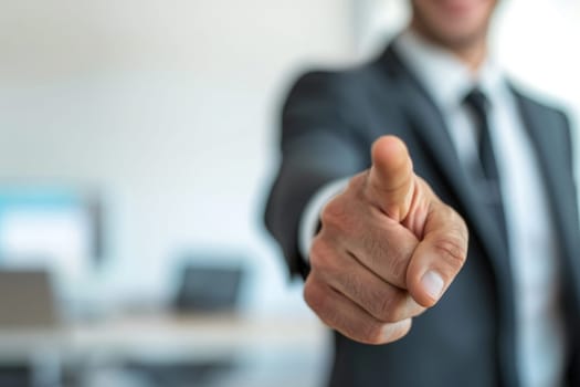 A man in a sharp suit confidently points directly at the viewer.