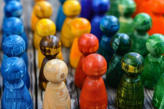 A close up view of a whimsical group of wooden toy figures standing together in a magical and enchanting setting.