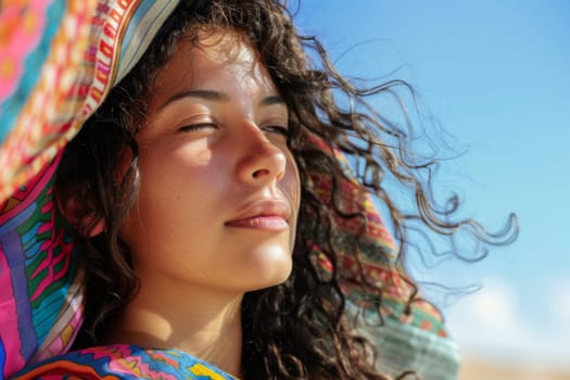 A woman stands elegantly wearing a vibrant, multicolored dress and a stylish hat. The dress is adorned with intricate patterns and the hat adds a touch of sophistication to her ensemble. She exudes confidence and style as she poses for the camera.