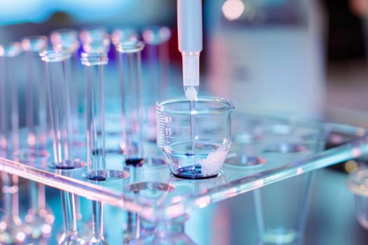 A linear arrangement of transparent test tubes, each containing different colored liquid, lined up on a laboratory bench. The liquids vary in hues from vibrant reds to deep blues, showcasing a diversity of chemical solutions and experiments.