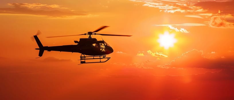 A helicopter in flight is silhouetted against a breathtaking sunset, showcasing the beauty of aviation and nature's backdrop