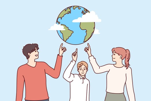 Environmentally conscious people of all ages point to planet together to call for stop to pollution and climate change. Family of parents and child recommends celebrating earth day for save planet