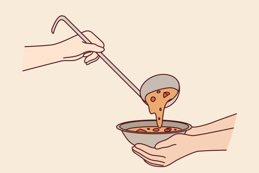 Plate of soup in hands of poor person receiving food from charity or shelter that provides nutrition for food stamps. Problem hunger and lack of money for three meals day, due to bankruptcies