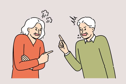Quarrel elderly man and woman expressing mutual complaints or insults accumulated over years of marriage. Quarrel old people due to political differences and oppositional views on government actions