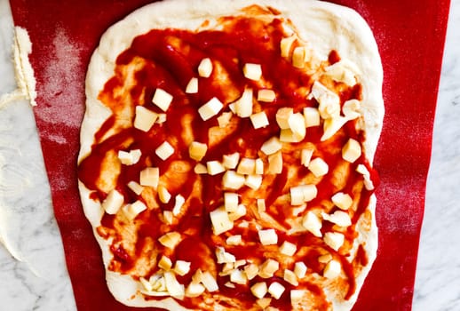 Preparing pizza  margherita at home