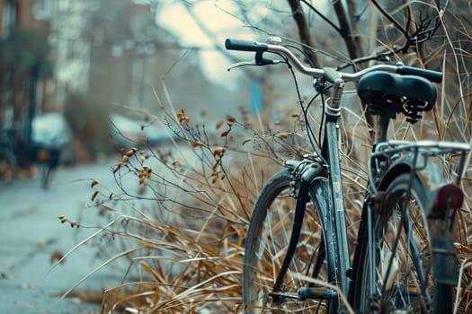 A bicycle is peacefully parked next to a lush tree on a tranquil sidewalk.