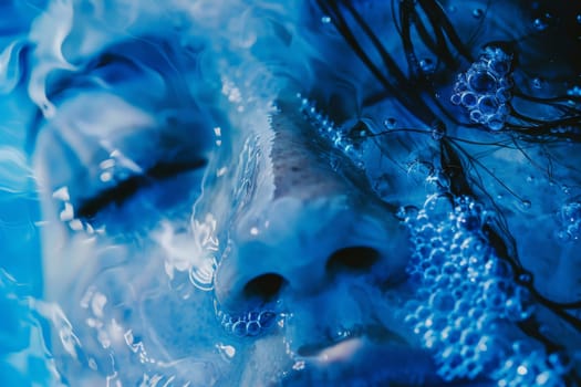 A womans face emerges gracefully from the water, showcasing serene beauty and tranquility.