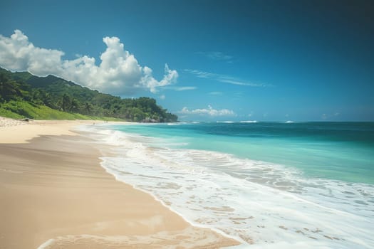 A tranquil sandy beach meets the vast ocean under a clear blue sky, creating a serene and picturesque scene of peaceful tranquility.