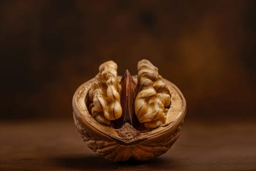 A close-up of a delicate nut shell resting on a table, showcasing its intricate texture and natural beauty.