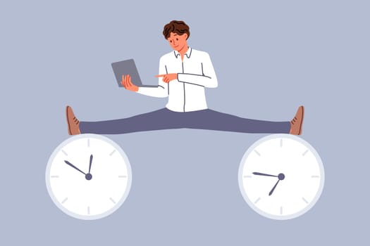 Business man enjoying flexible work schedule, does splits at two clock symbolizing deadlines and holding laptop in hands. Nimble guy demonstrates productivity skills to meet deadlines